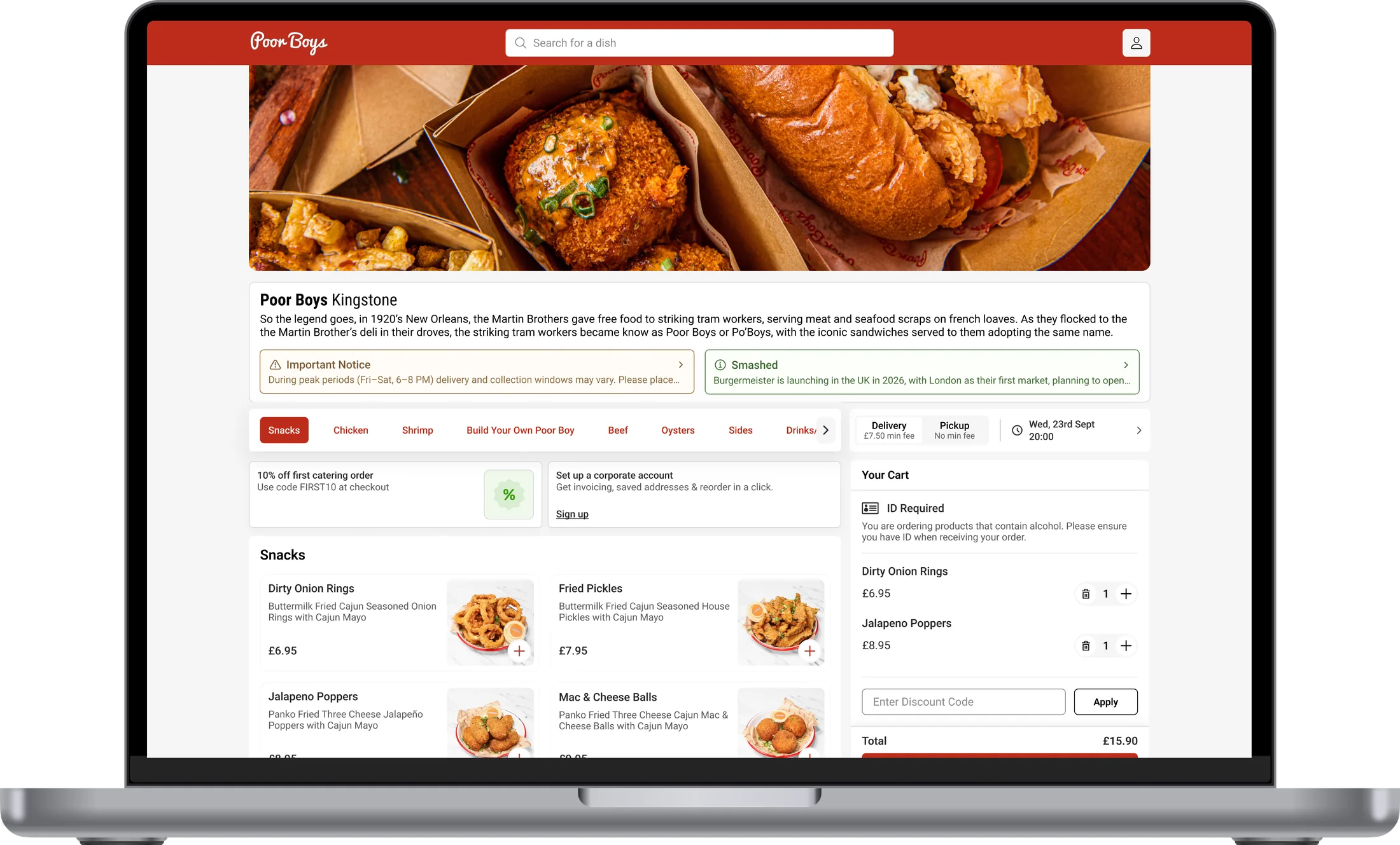 The Poor Boys ordering site on a laptop: red header, a photo of po' boys in their branded boxes, the snacks menu and a cart
