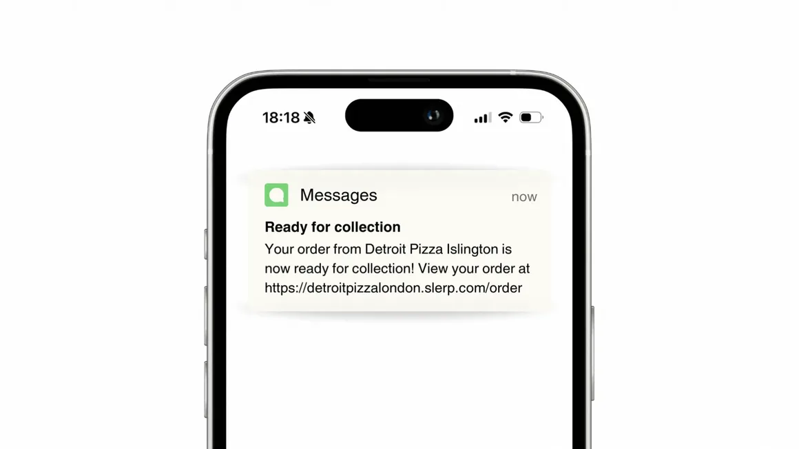 A Ready for collection text message on a phone, telling the customer their order is ready to collect